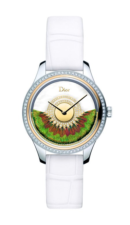 <p>This <strong>Dior Grand Bal Plume</strong> watch is decorated with colorful peacock feathers which create a beautiful contrast with the white mother-of-pearl of its dial and the white strap.</p>