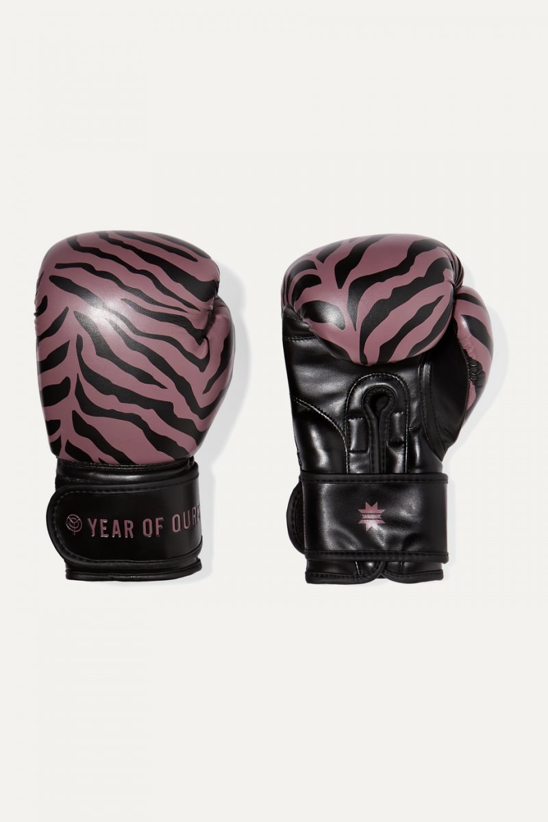 <strong>Year of Ours</strong>, + Kali Active tiger-print faux leather boxing gloves for her<br /> <em>Via Net-a-Porter</em>