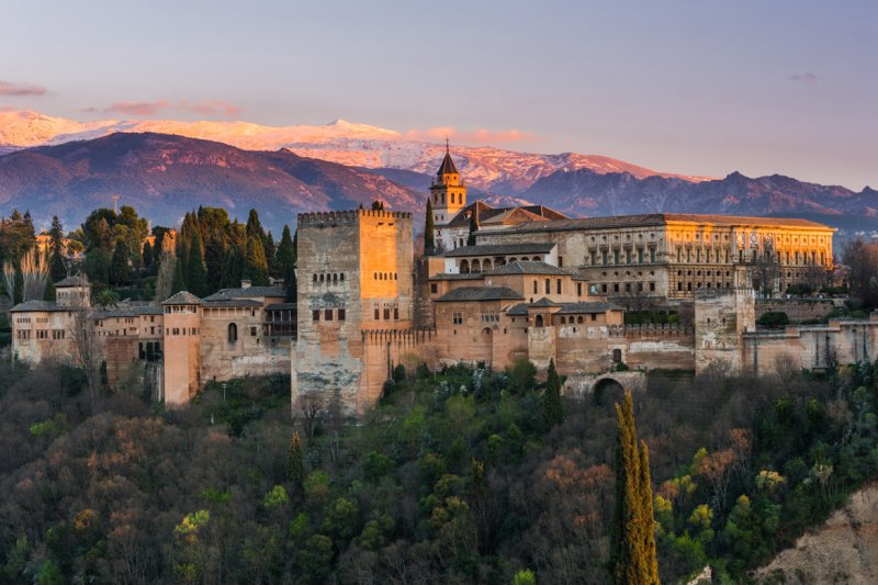 <strong>Granada, Spain </strong><br />
Winter has its unique charm in this Spanish destination. If you’re a fan of a city that’s so generous in traditions, this is the best time of year to be there. From the Dia de San Anton on January 17th to the unique landscapes and of course, the Alhambra, you will certainly spend an amazing winter break!