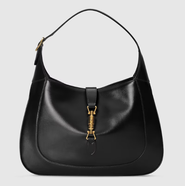 <strong>The Jackie 1961 by Gucci</strong><br />
First created as a hobo bag, this design introduced by Gucci in 1961 under the name of the Fifties Constance caught the eye of Jackie Kennedy. After the release of a paparazzi image of the First Lady carrying the bag, the name was switched to Jackie 1961. In 2021, Alessandro Michele gave it more structure, an adjustable strap and a piston closure – making it a modern icon in the world of accessories.<br />
