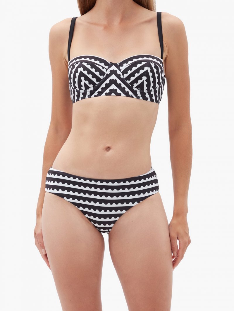 When it comes to choosing the perfect swimsuit for a body with a<strong> large bust</strong>, support is key and nothing can offer it like a swimsuit with an underwired cup. What’s also necessary if you want to draw the attention away from your top half is to avoid all tops that add volume to your chest such as ruffles and embellishments. And hey, don’t underestimate the power of thicker straps, which offer even more support.<br /> <strong>Mary Mare</strong><br /> <em>Via Matches Fashion</em>