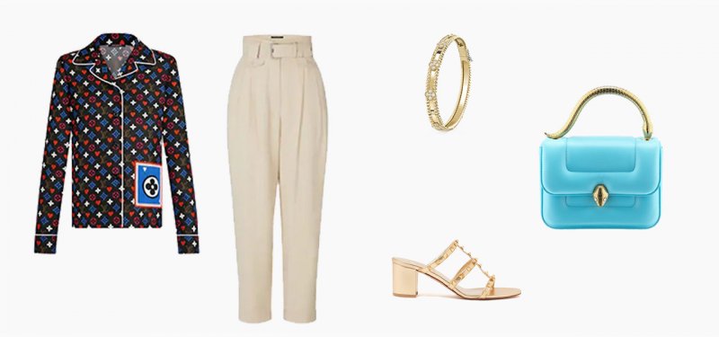 <strong>Louis Vuitton</strong> pants<br /> <strong>Louis Vuitton</strong> pajama top<br /> <strong>Valentino</strong> mules<br /> <em>Available on Ounass.com</em><br /> <strong>Van Cleef & Arpels</strong> Perlée bracelet<br /> <strong>Mary Katrantzou x Bvlgari</strong> bag